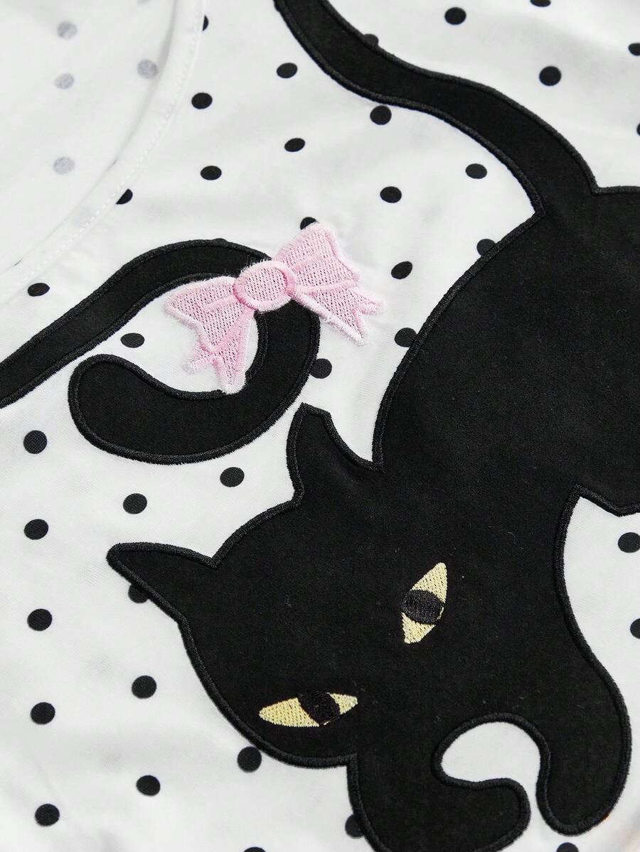 White slim fit square neck polka dot camisole top featuring cat and butterfly graphic print with studded arm sleeves.