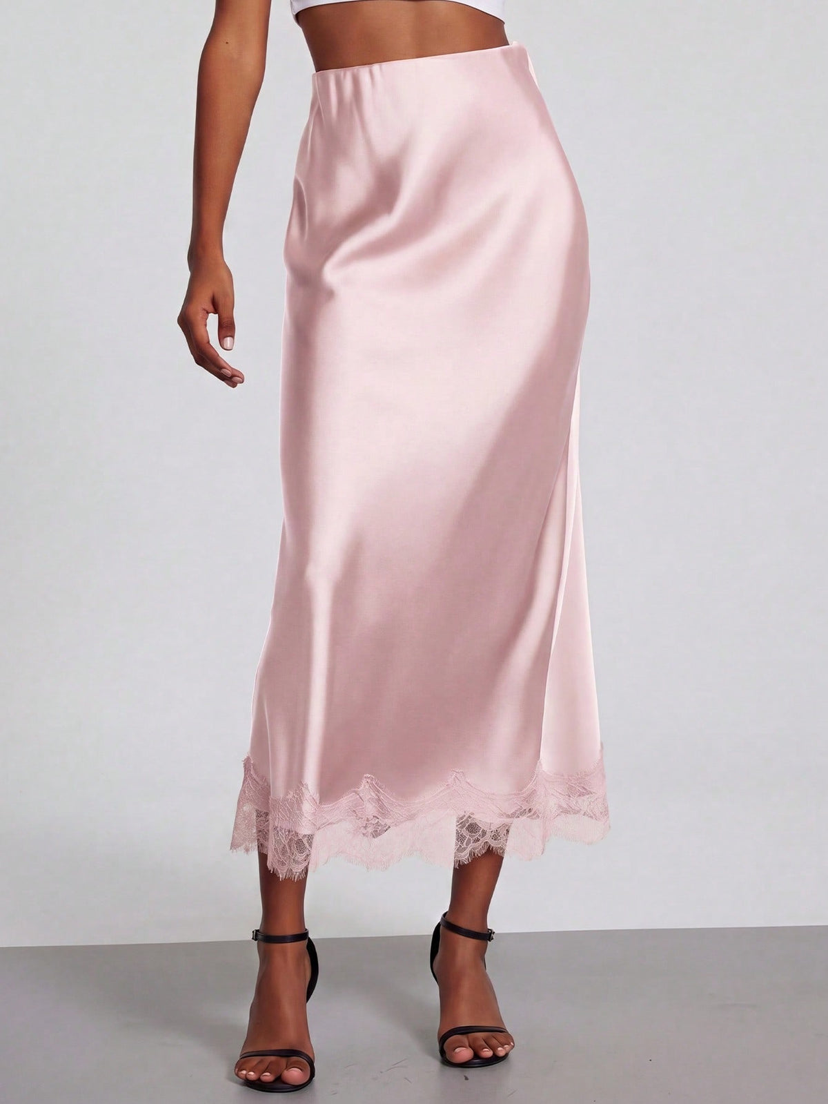 Women's black lace patchwork satin skirt featuring a long bodycon silhouette and natural mid waist design.