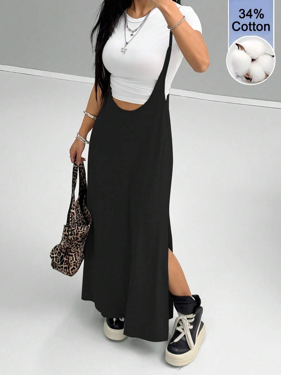 Women's black sleeveless spaghetti strap long cami dress with a side split thigh in high-stretch knitted fabric.