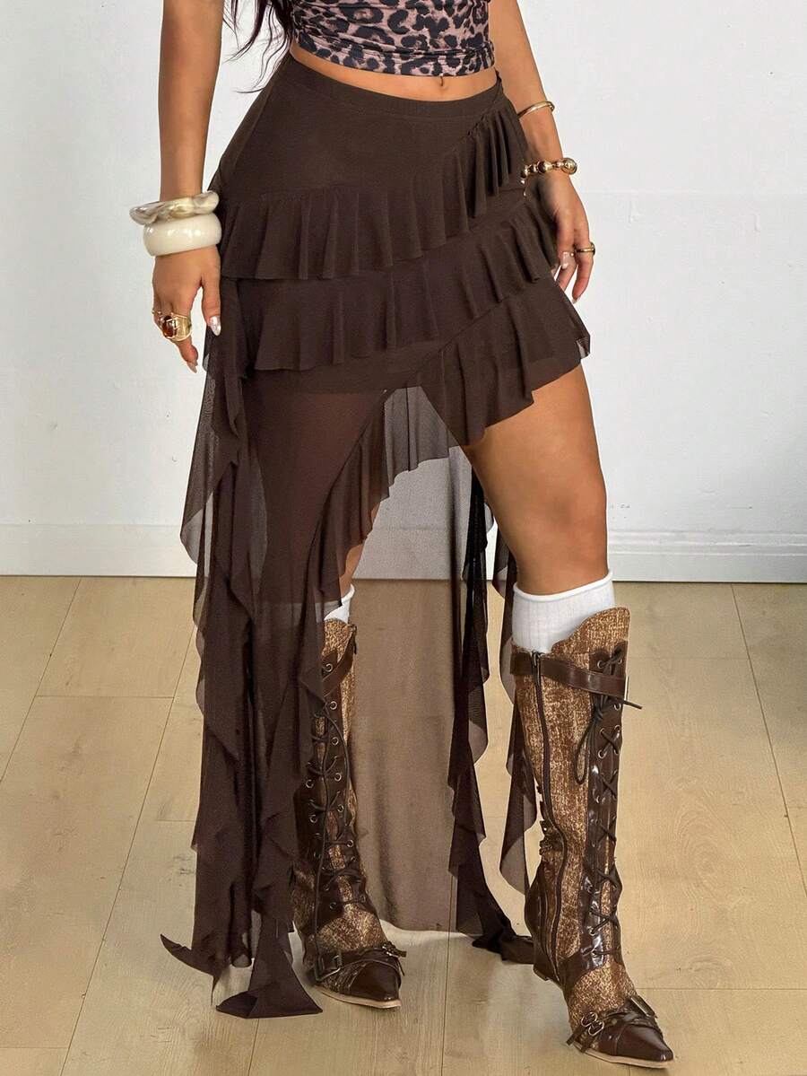 Women's low rise asymmetrical long skirt with tiered ruffle details in stretch knitted fabric.
