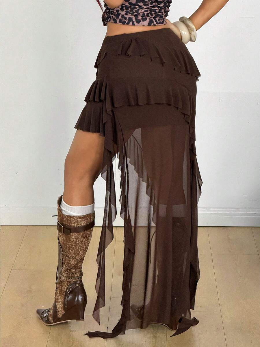 Women's low rise asymmetrical long skirt with tiered ruffle details in stretch knitted fabric.