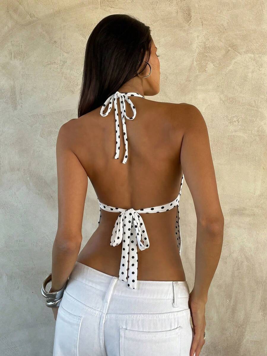 Women's black faux leather backless cami top with spaghetti straps and lace-up shirred sides.