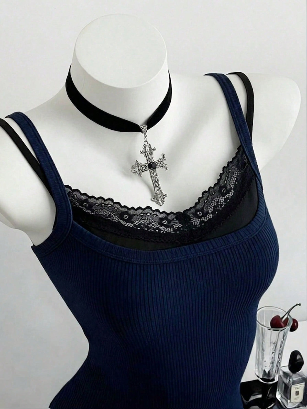 Women's slim fit spaghetti strap cami tank top with contrast lace trim along the neckline