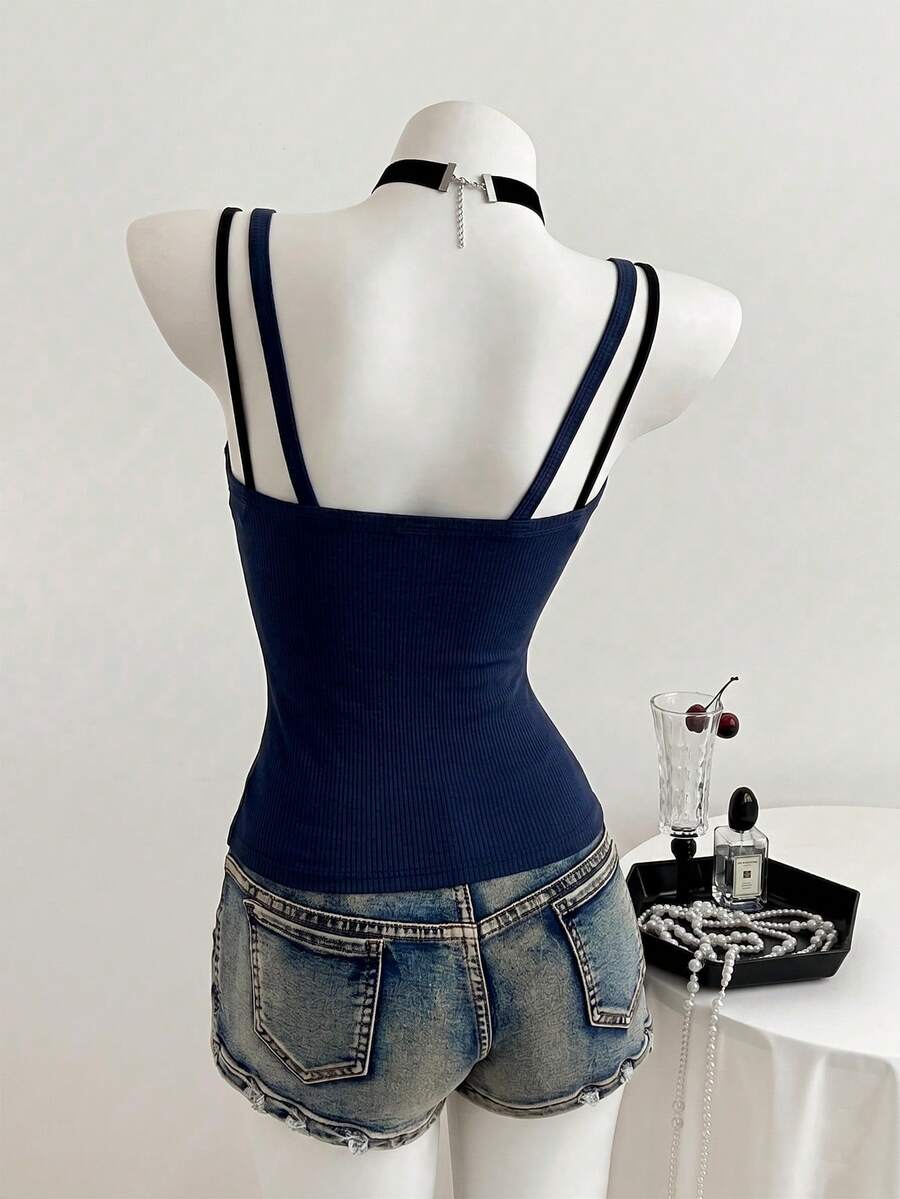 Women's slim fit spaghetti strap cami tank top with contrast lace trim along the neckline