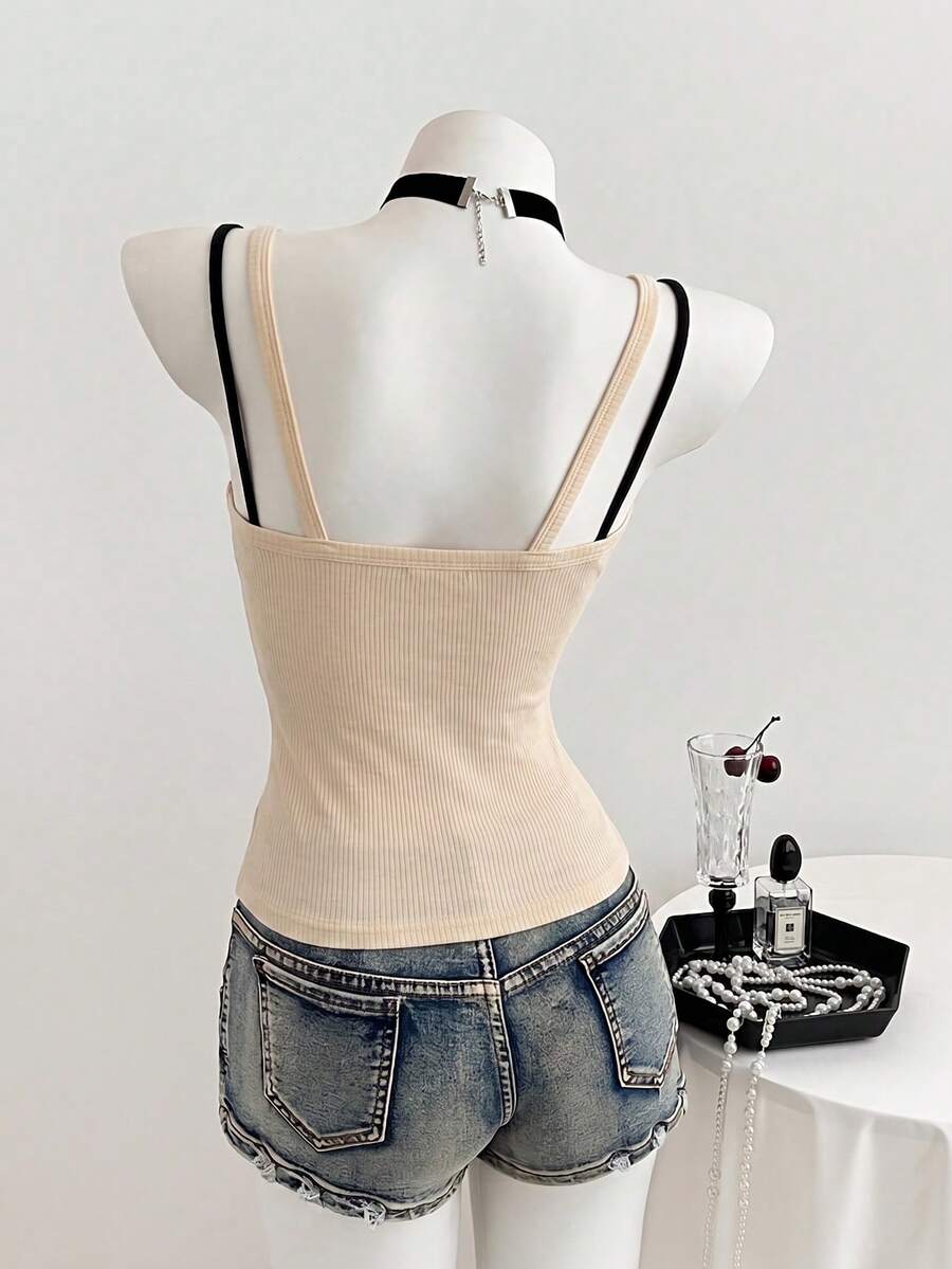 Women's slim fit spaghetti strap cami tank top with contrast lace trim along the neckline