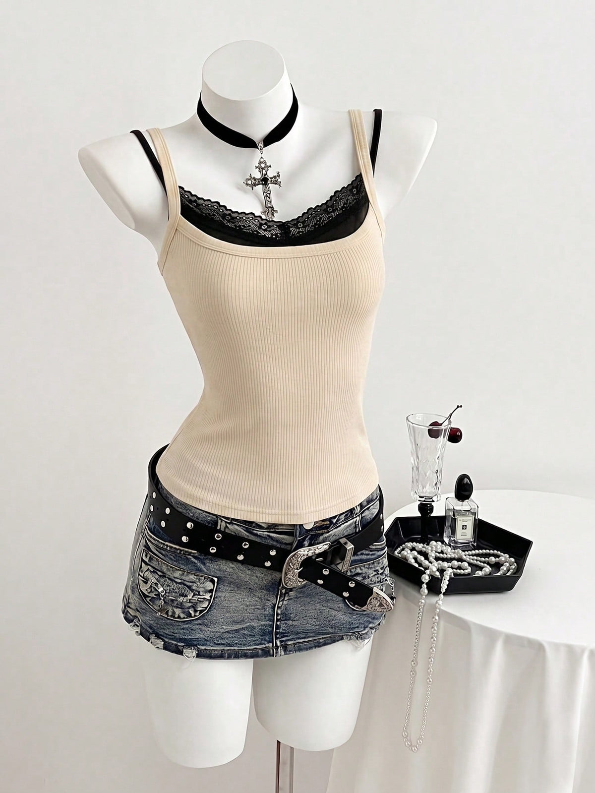 Women's slim fit spaghetti strap cami tank top with contrast lace trim along the neckline