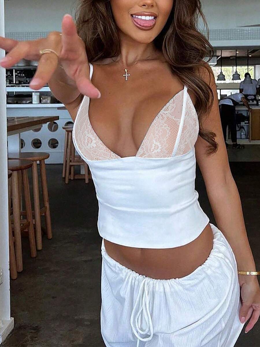 Women's V-neck backless camisole crop top with ruched detailing in a slim fit knit fabric.