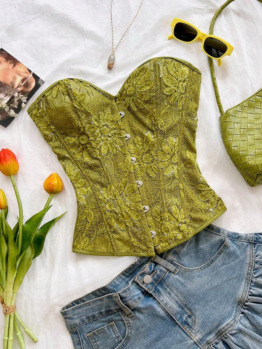 Strapless black lace-up corset top for women with grommet eyelet details, slim fit, lined body, and woven fabric construction.