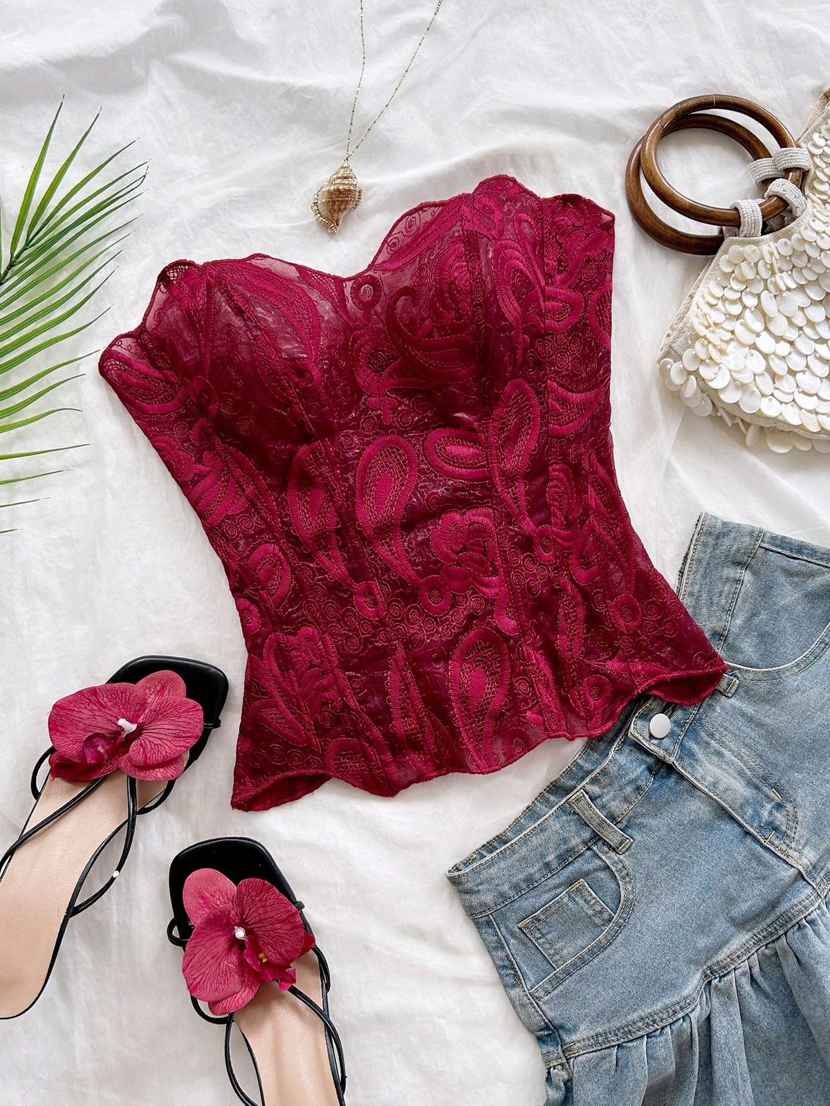 Strapless floral lace corset top with lace-up detail, asymmetrical hem, and slim fit for women.