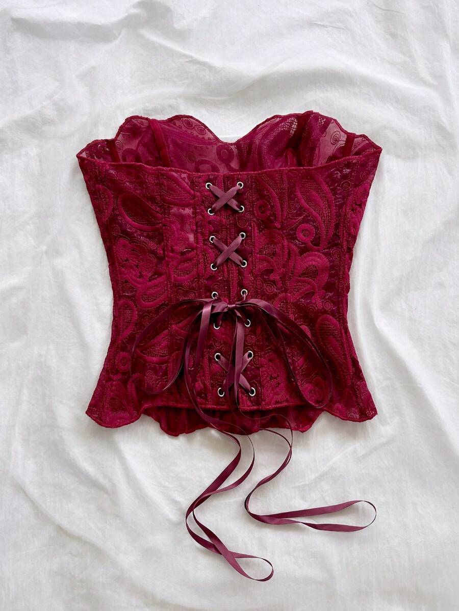 Strapless floral lace corset top with lace-up detail, asymmetrical hem, and slim fit for women.