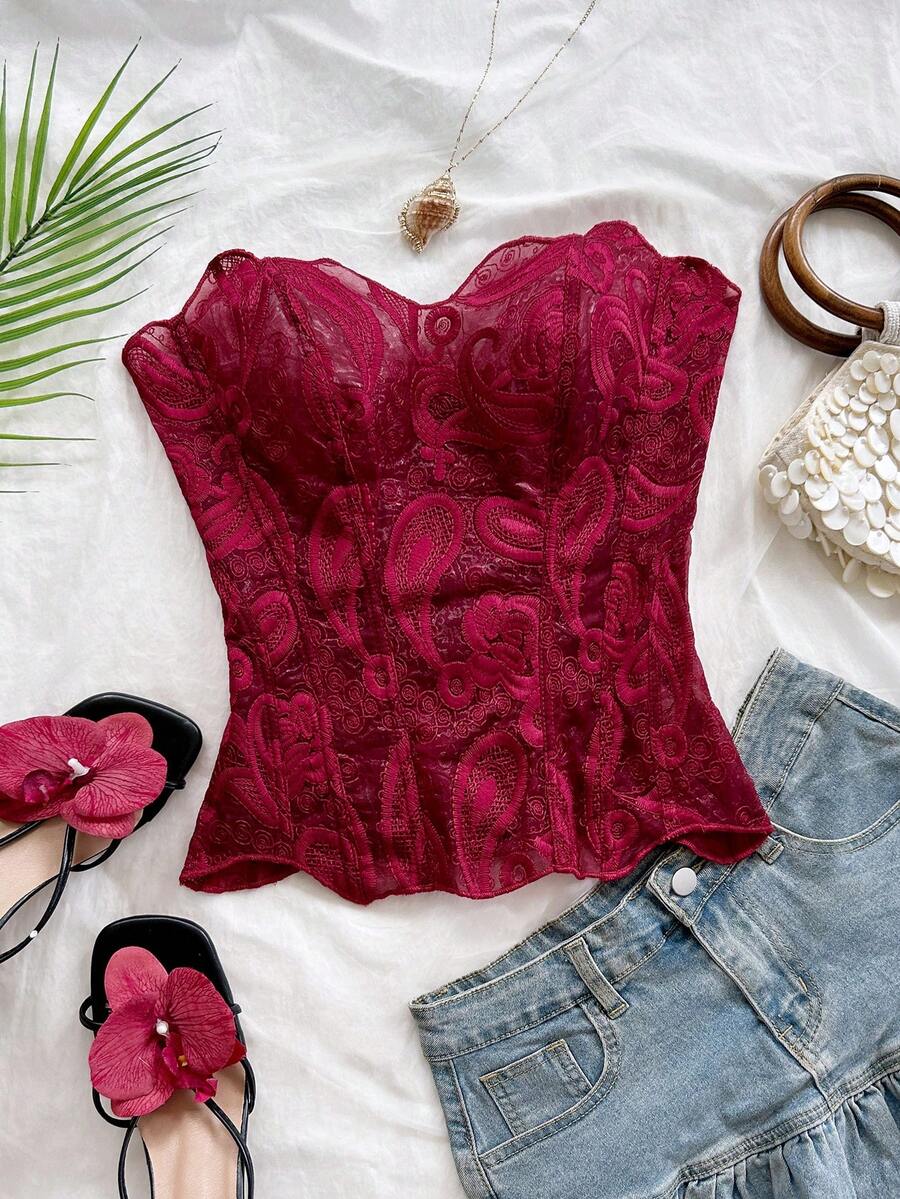 Strapless floral lace corset top with lace-up detail, asymmetrical hem, and slim fit for women.