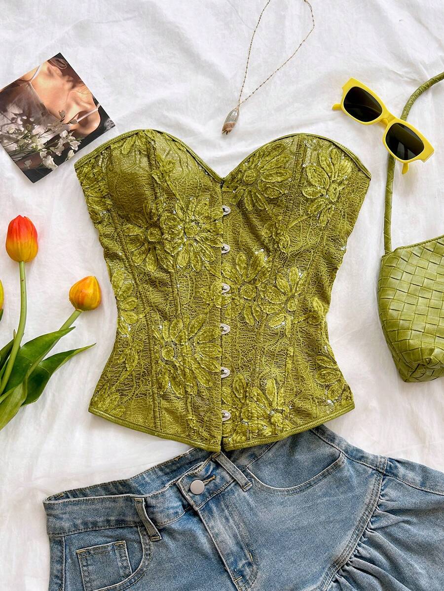 Strapless black lace-up corset top for women with grommet eyelet details, slim fit, lined body, and woven fabric construction.