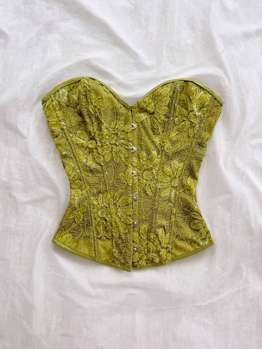 Strapless black lace-up corset top for women with grommet eyelet details, slim fit, lined body, and woven fabric construction.