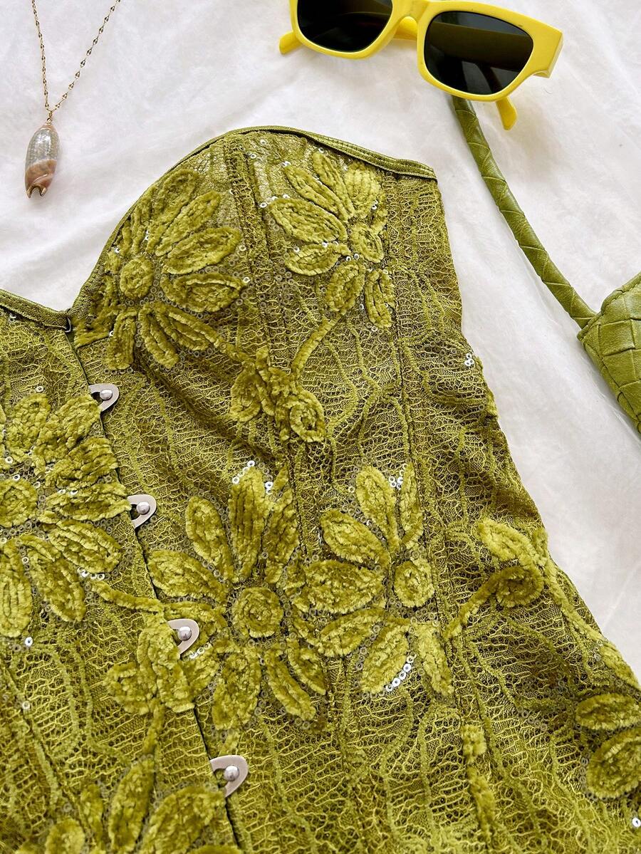 Strapless black lace-up corset top for women with grommet eyelet details, slim fit, lined body, and woven fabric construction.