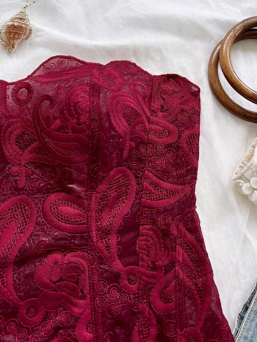 Strapless floral lace corset top with lace-up detail, asymmetrical hem, and slim fit for women.