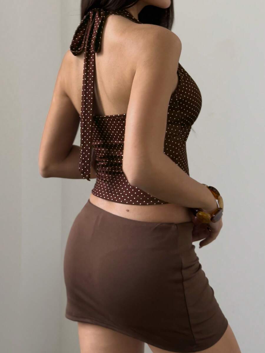Women's sleeveless halter crop top featuring contrast lace trim and a slim fit design.