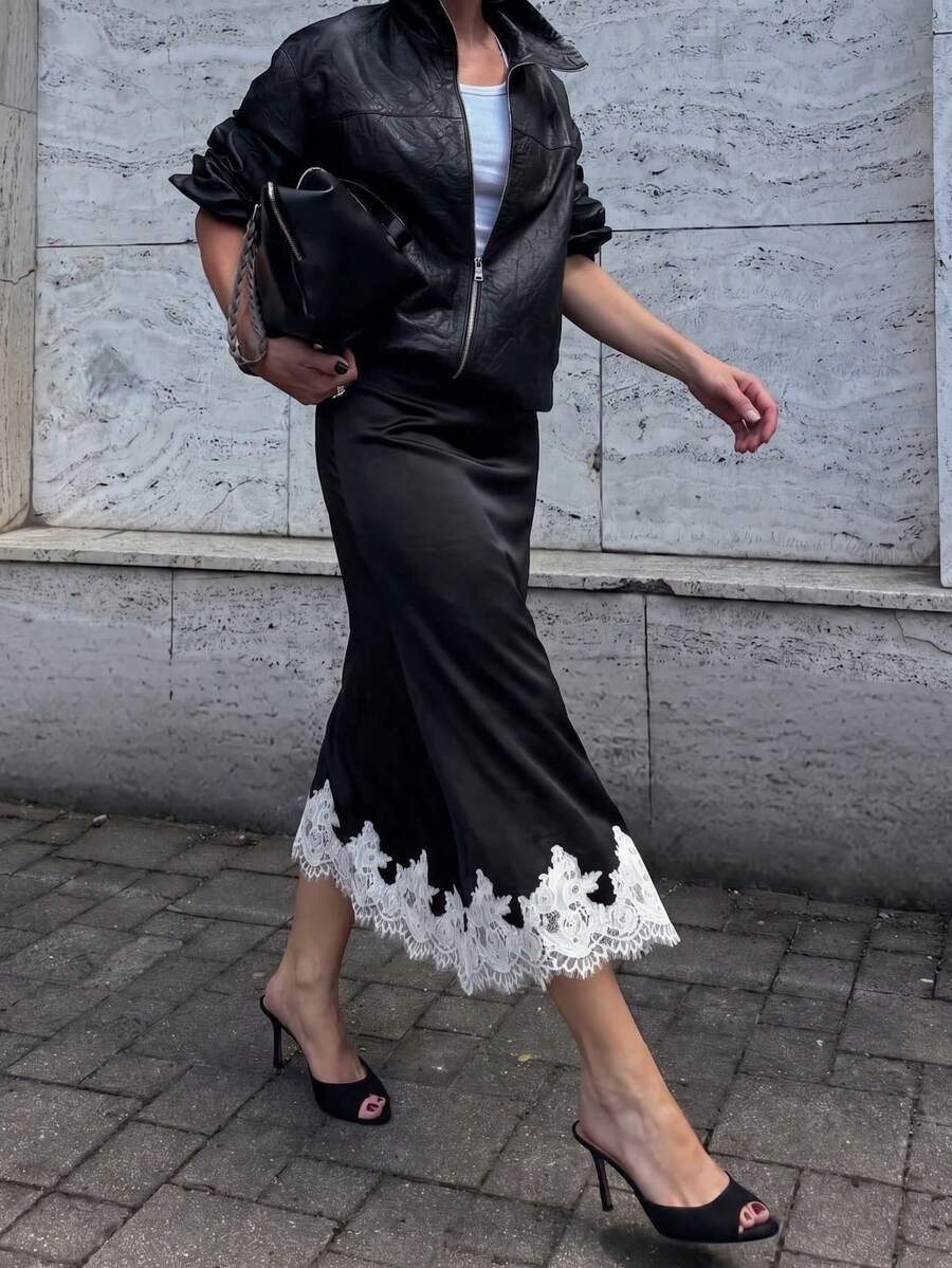Women's apricot satin flared long skirt featuring contrast lace details, hollow out accents, polka dot pattern, and a low waist regular fit.