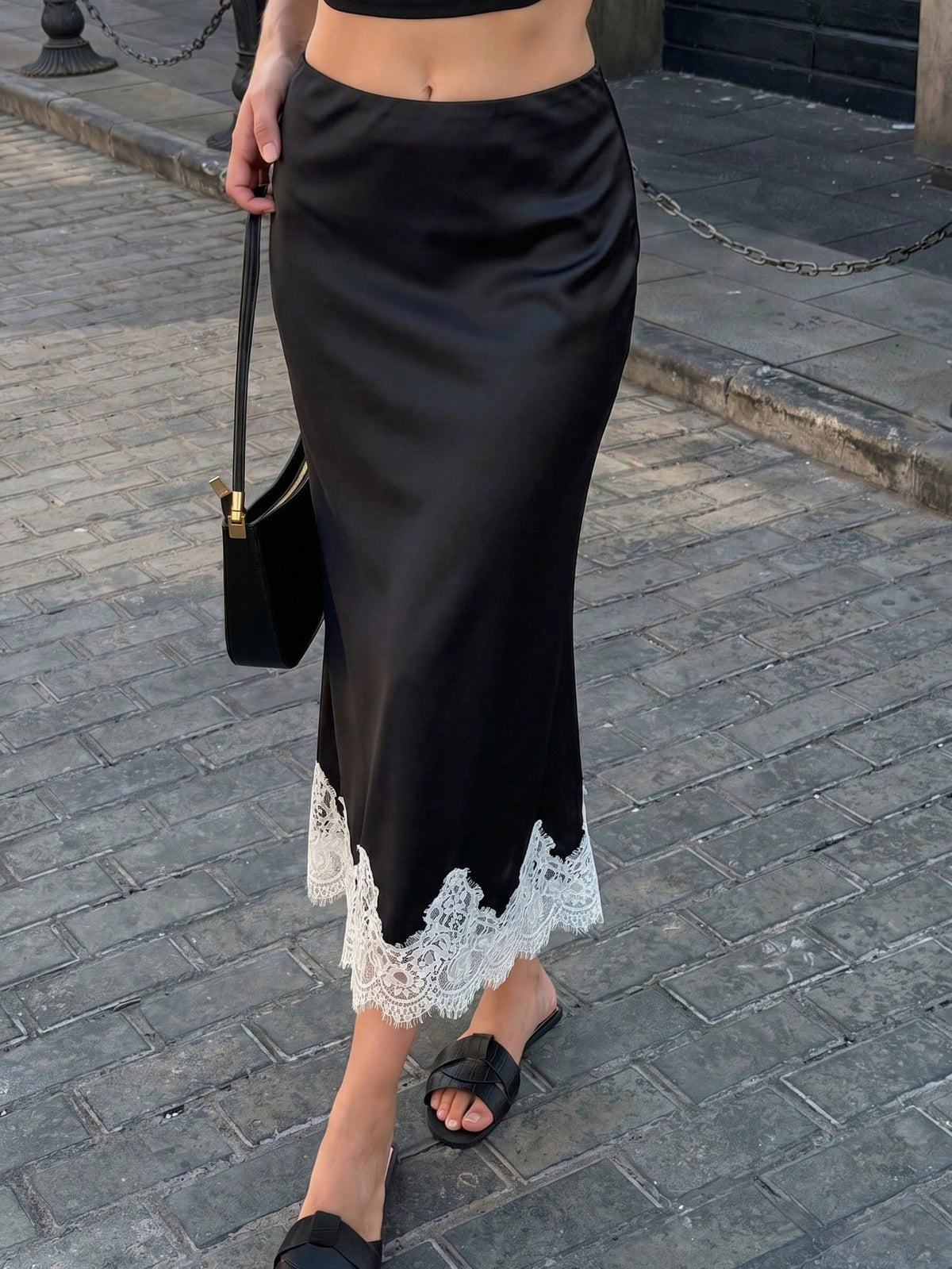 Women's apricot satin flared long skirt featuring contrast lace details, hollow out accents, polka dot pattern, and a low waist regular fit.