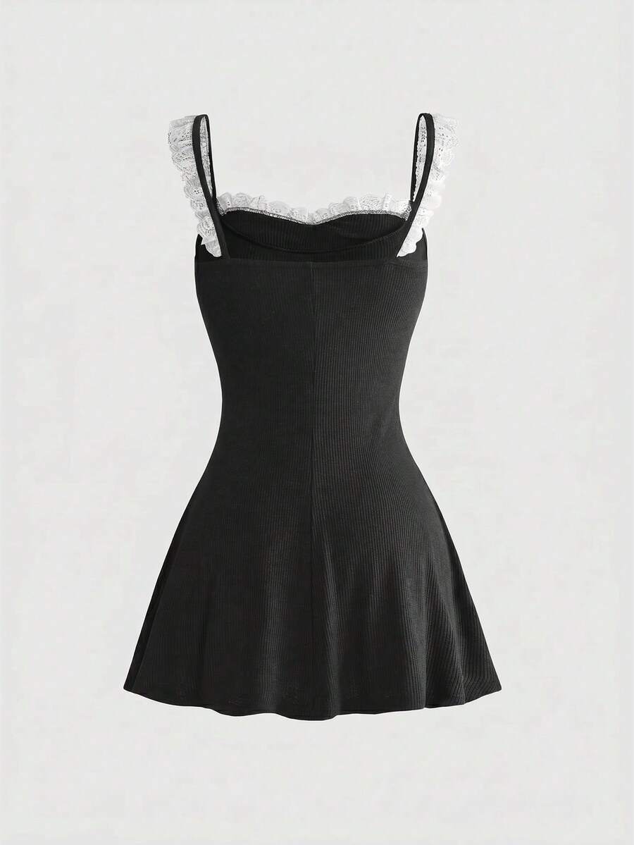 Women's sleeveless black colorblock cami mini dress with shoulder straps, frill detailing, slim fit waist, and flared hem.