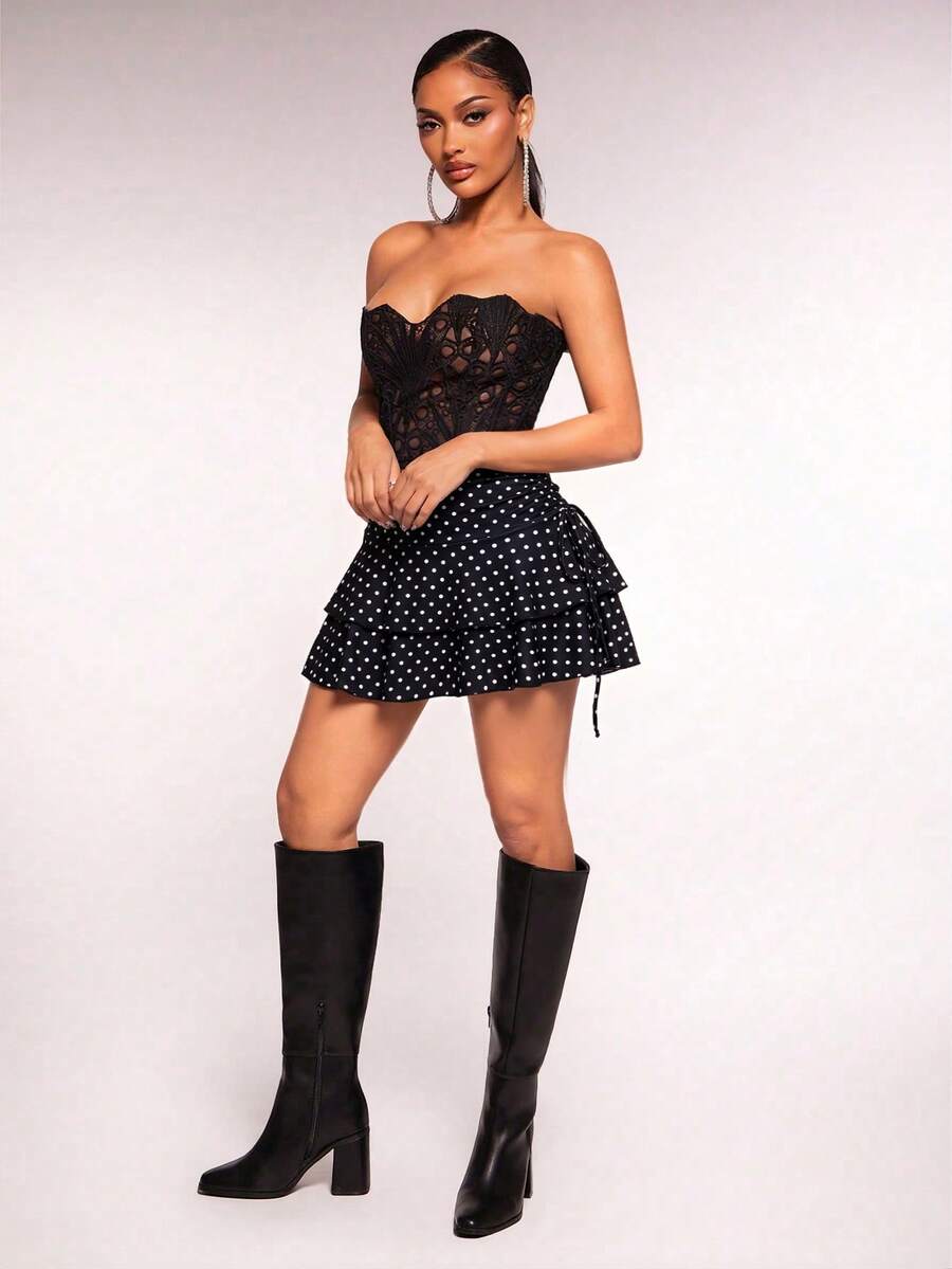 Women's black PU coated layered ruffle mini skirt featuring a high waist, tiered ruffle hem, and zipper detail.