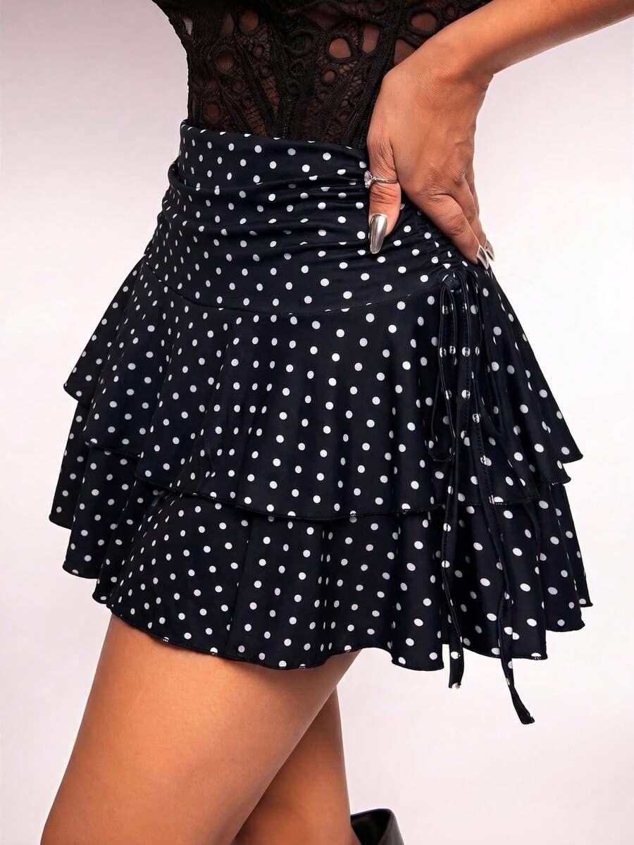 Women's black PU coated layered ruffle mini skirt featuring a high waist, tiered ruffle hem, and zipper detail.