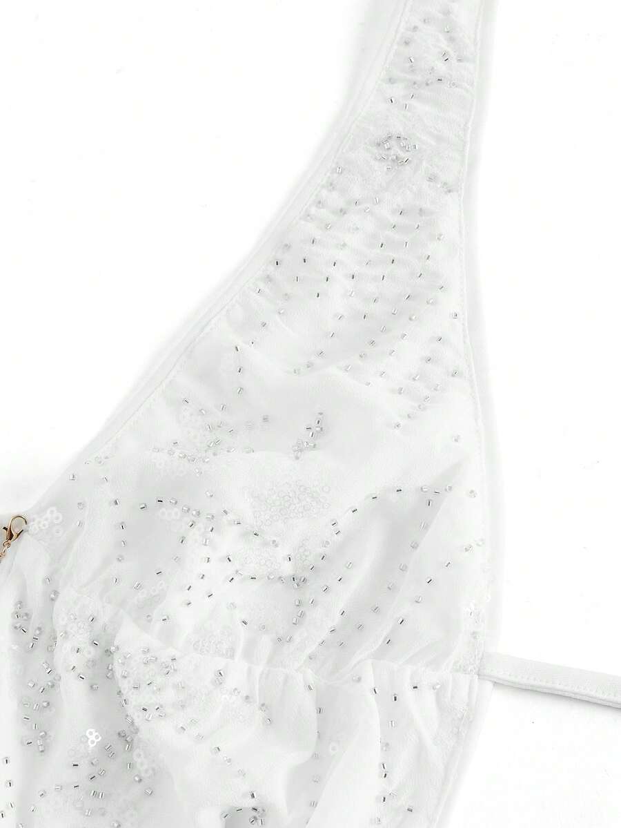 Pink sequin halter tank top for women featuring embroidered draped backless design and asymmetrical hem.