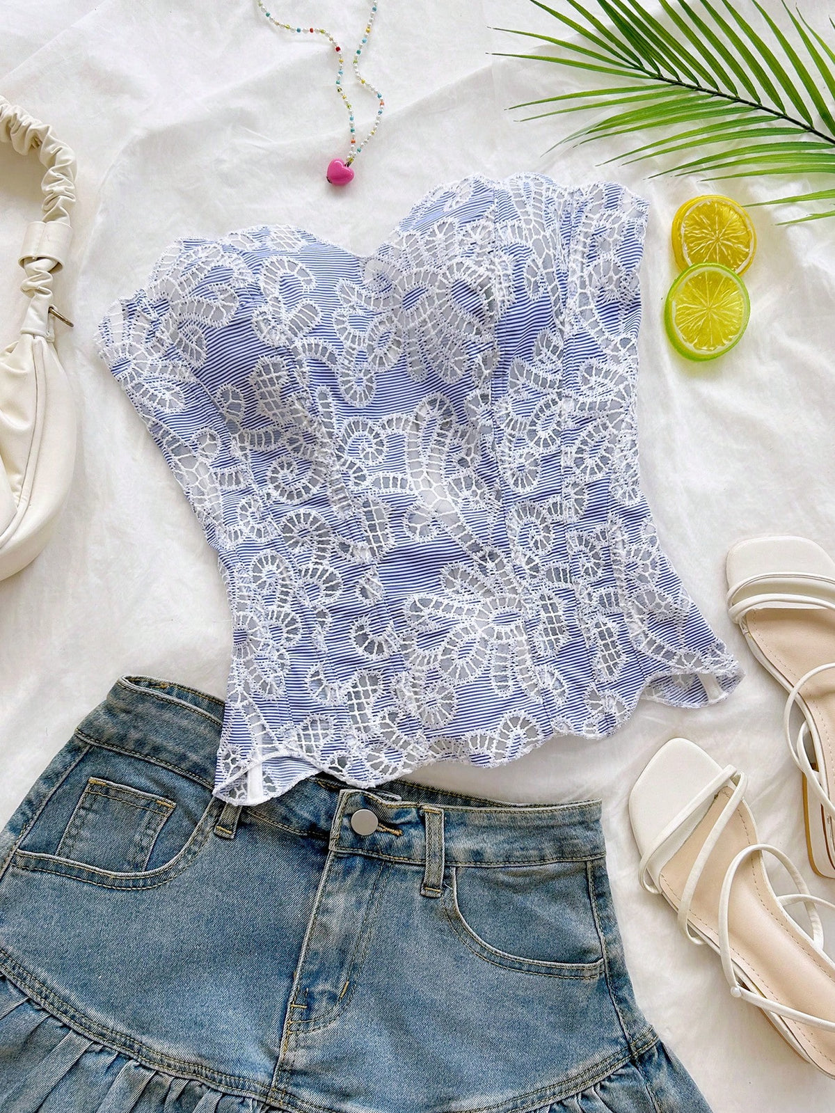 Strapless floral lace corset top with lace-up detail, asymmetrical hem, and slim fit for women.