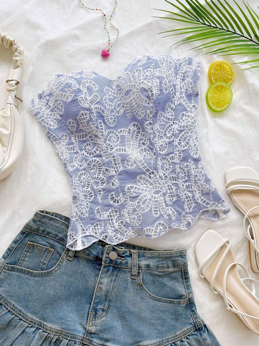 Strapless floral corset top with lace-up detail, asymmetrical hem, and slim fit for women in a boho vacation style.