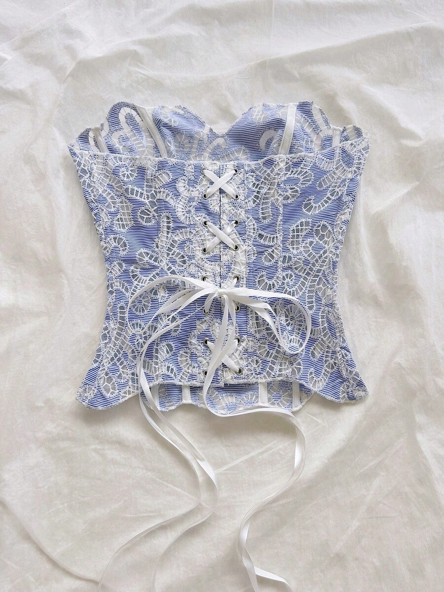 Strapless floral corset top with lace-up detail, asymmetrical hem, and slim fit for women in a boho vacation style.
