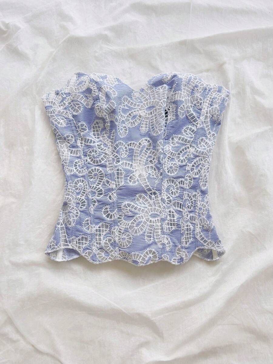 Strapless floral lace corset top with lace-up detail, asymmetrical hem, and slim fit for women.