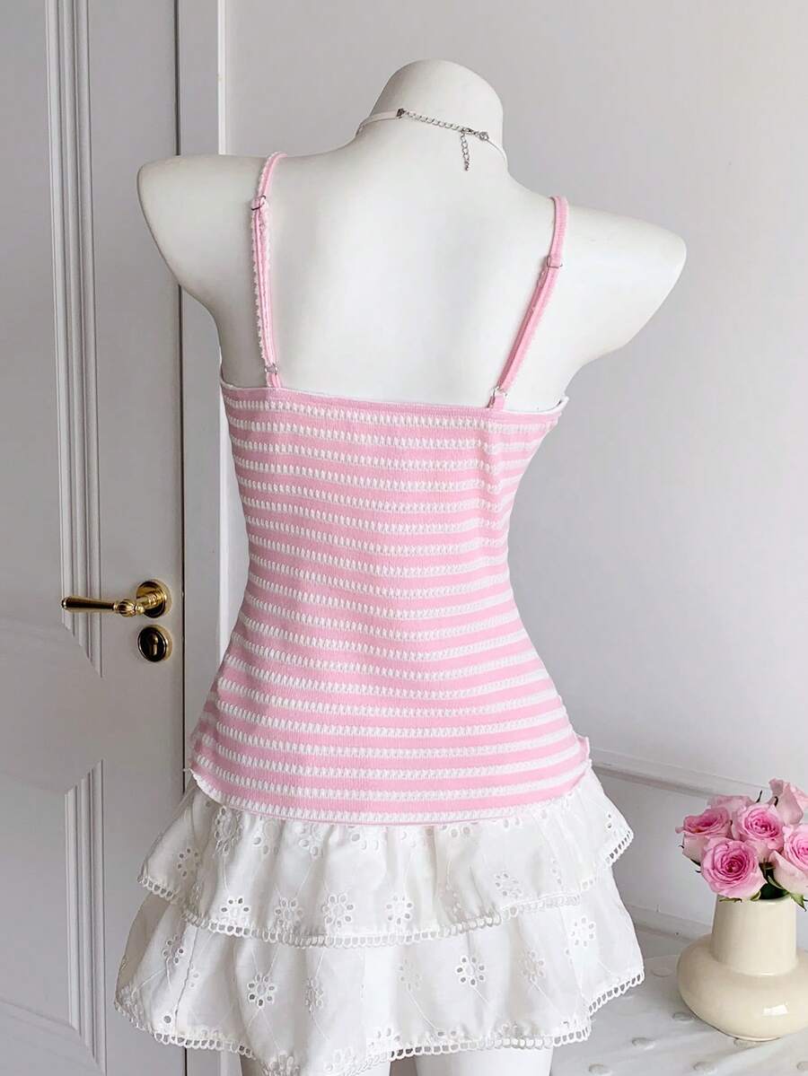Black and white polka dot tie strap camisole top for women with thin spaghetti straps and slim fit.