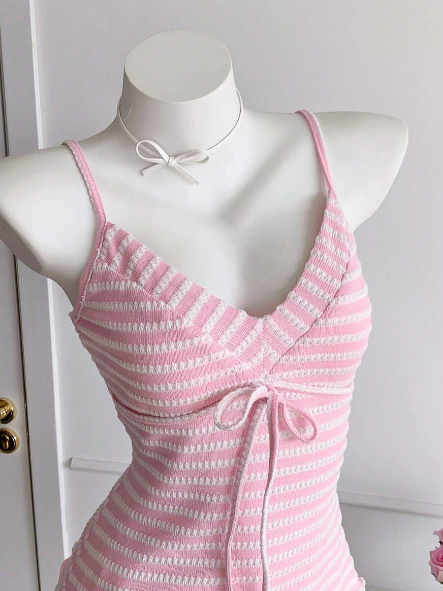 Black and white polka dot tie strap camisole top for women with thin spaghetti straps and slim fit.