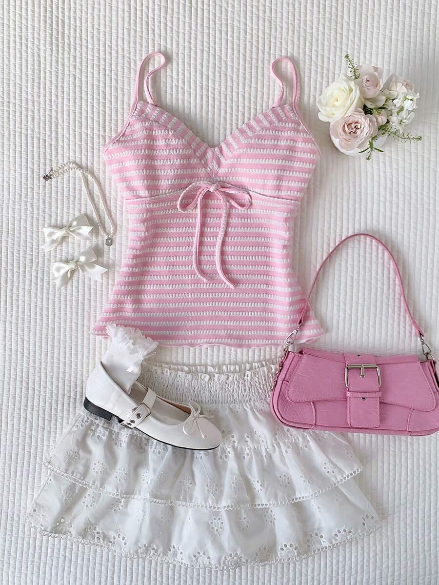 Black and white polka dot tie strap camisole top for women with thin spaghetti straps and slim fit.