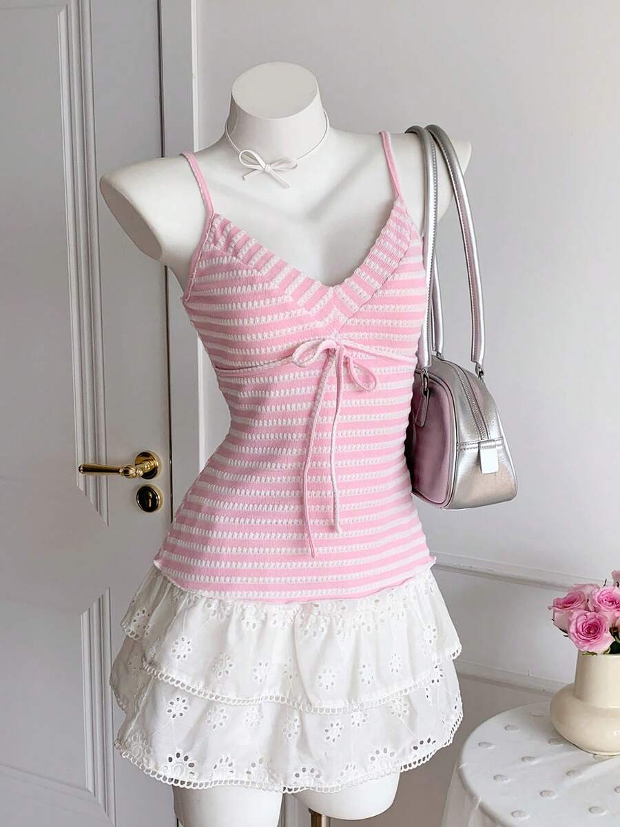 Black and white polka dot tie strap camisole top for women with thin spaghetti straps and slim fit.