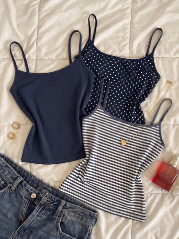 Navy blue women's geometric print spaghetti strap cami tank top with regular fit on plain background.