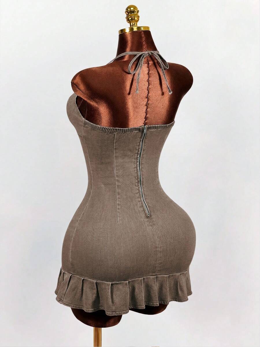Women's blue denim halter mini dress featuring front cut-out details and a flounce ruffle hem.