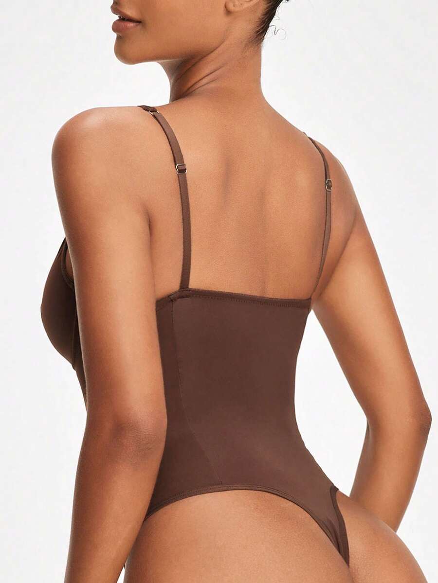 Apricot backless shapewear bodysuit with thong cut, cup details, and high-stretch fabric for light tummy support.