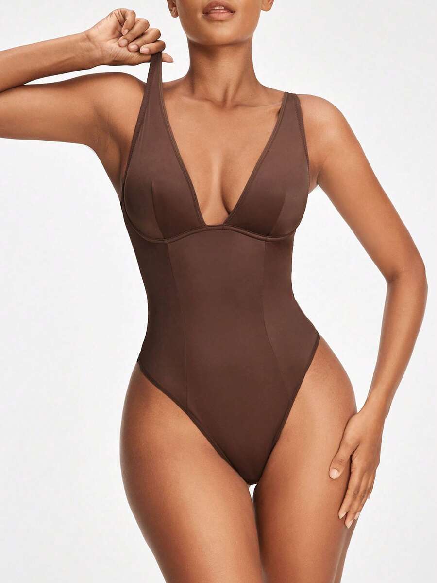 Apricot backless shapewear bodysuit with thong cut, cup details, and high-stretch fabric for light tummy support.