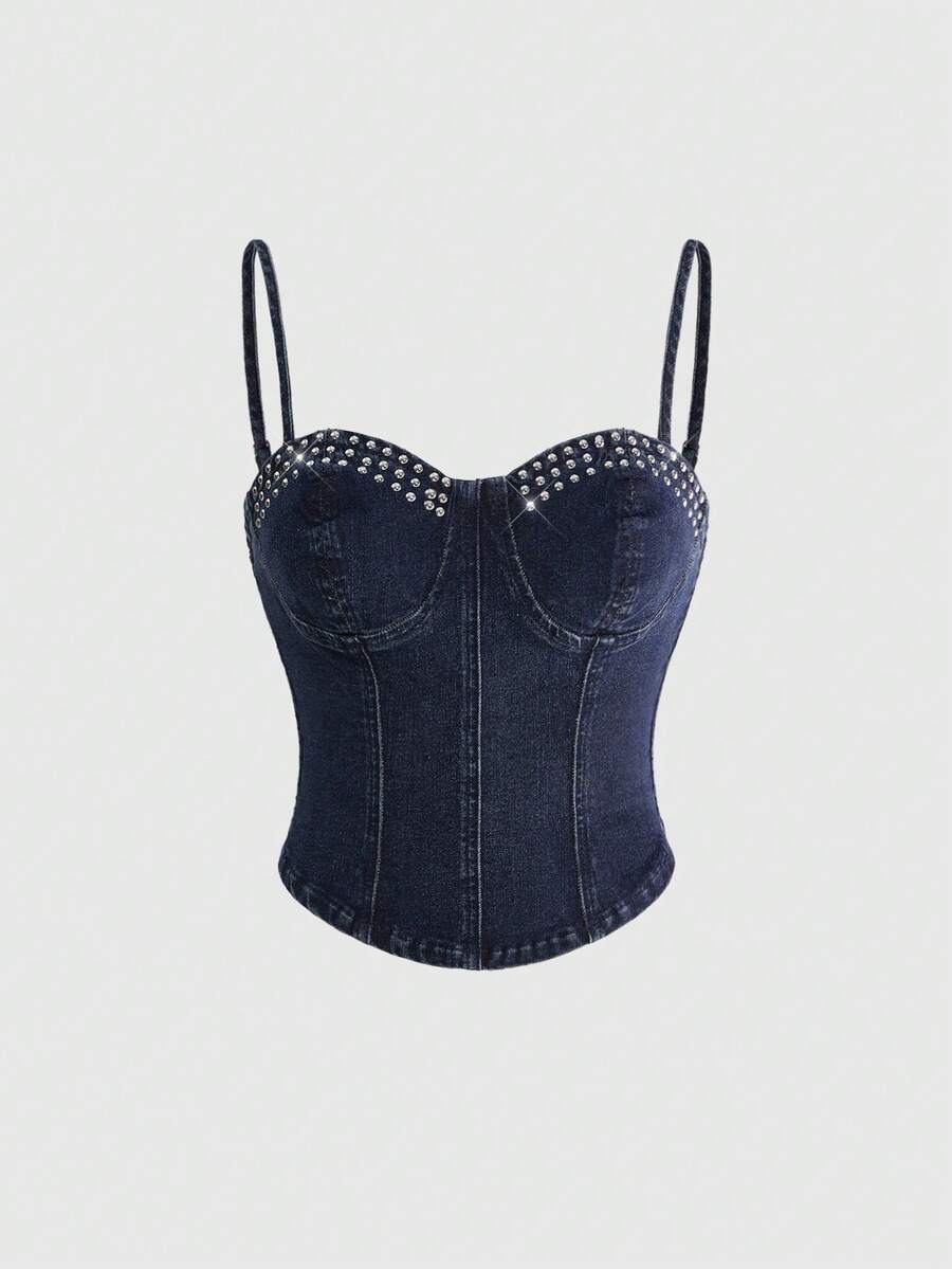 Dark wash denim camisole top for women with rhinestone embellishments, spaghetti straps, front zipper closure, and an asymmetrical micro crop hem.