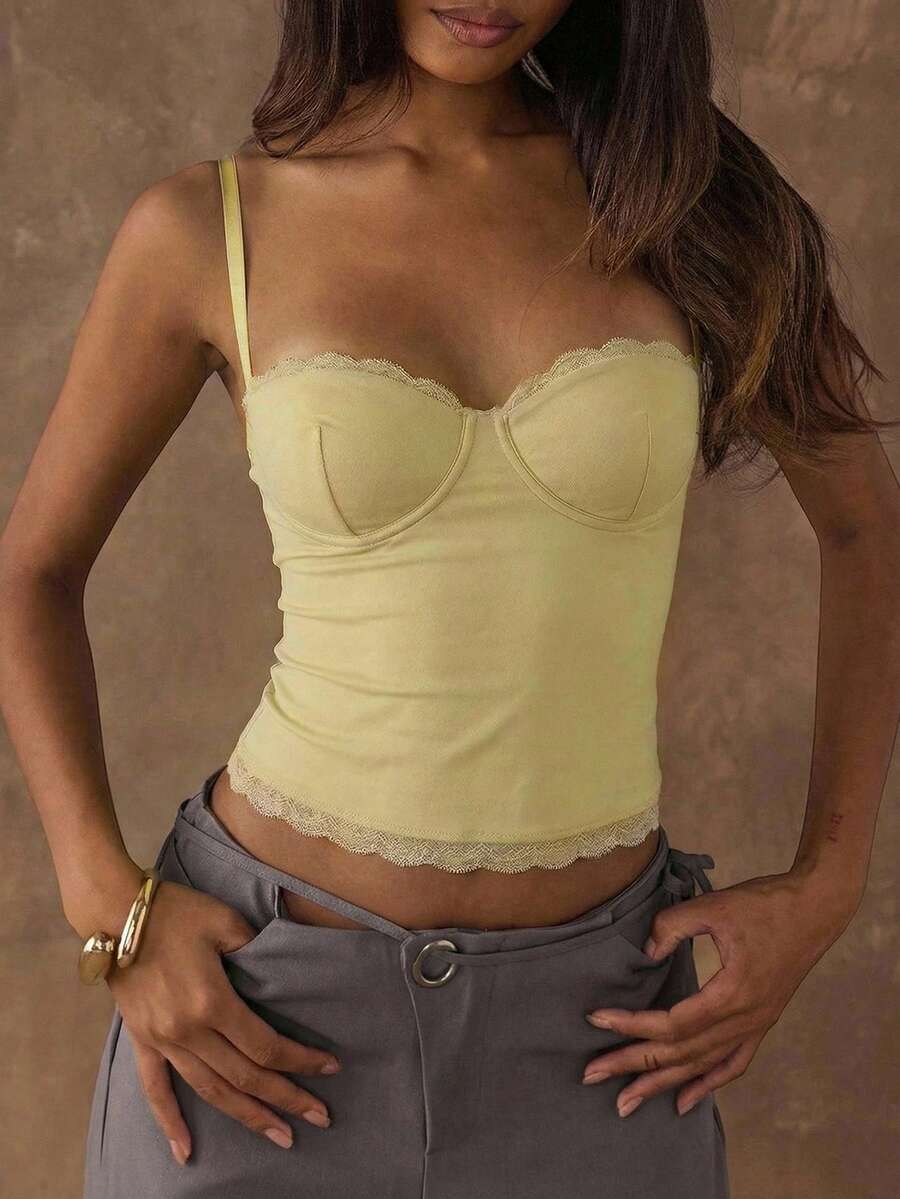 Women's black contrast lace camisole with spaghetti straps, cup detail, semi-sheer finish, and slim fit for going out or date night.