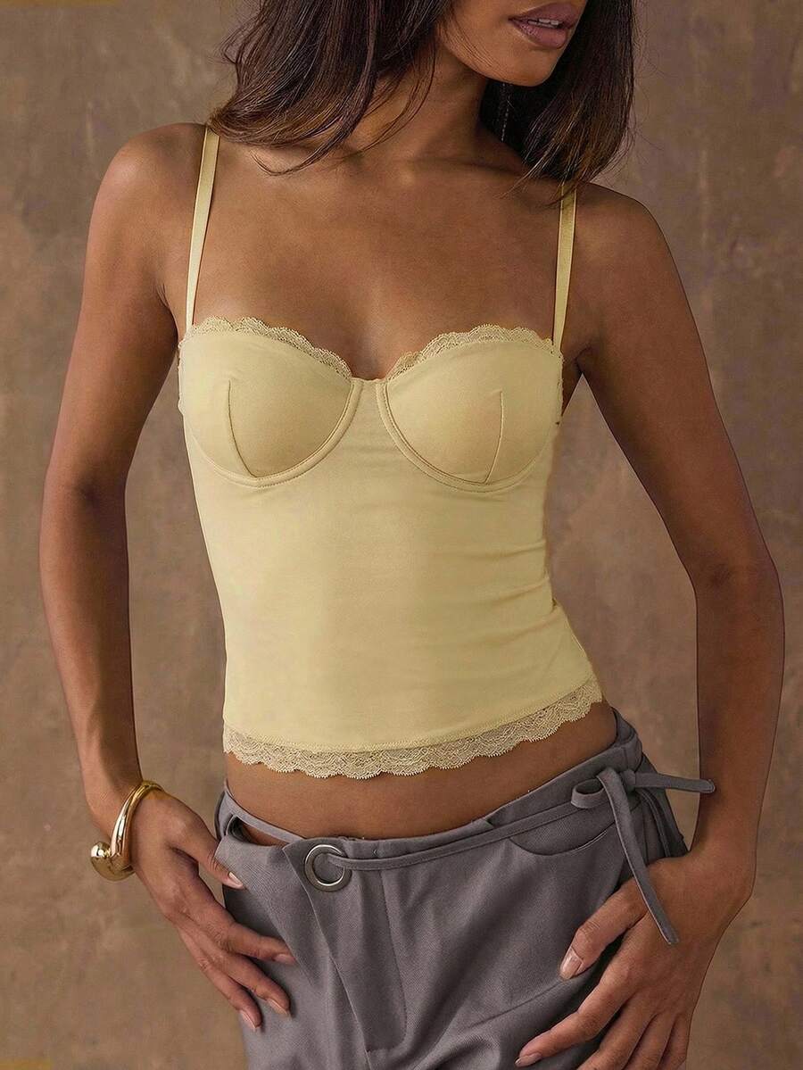 Women's black contrast lace camisole with spaghetti straps, cup detail, semi-sheer finish, and slim fit for going out or date night.