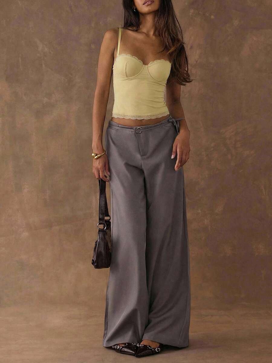 Women's black contrast lace camisole with spaghetti straps, cup detail, semi-sheer finish, and slim fit for going out or date night.