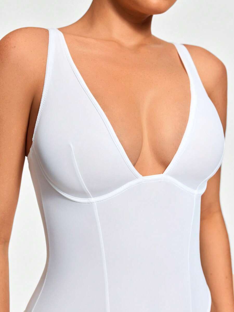 Apricot backless shapewear bodysuit with thong cut, cup details, and high-stretch fabric for light tummy support.