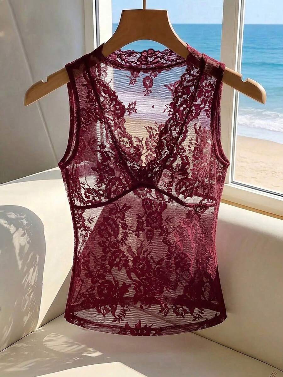 Franclia women's black semi-sheer lace camisole featuring a deep V-neckline with contrast lace trim in a slim fit sleeveless design.