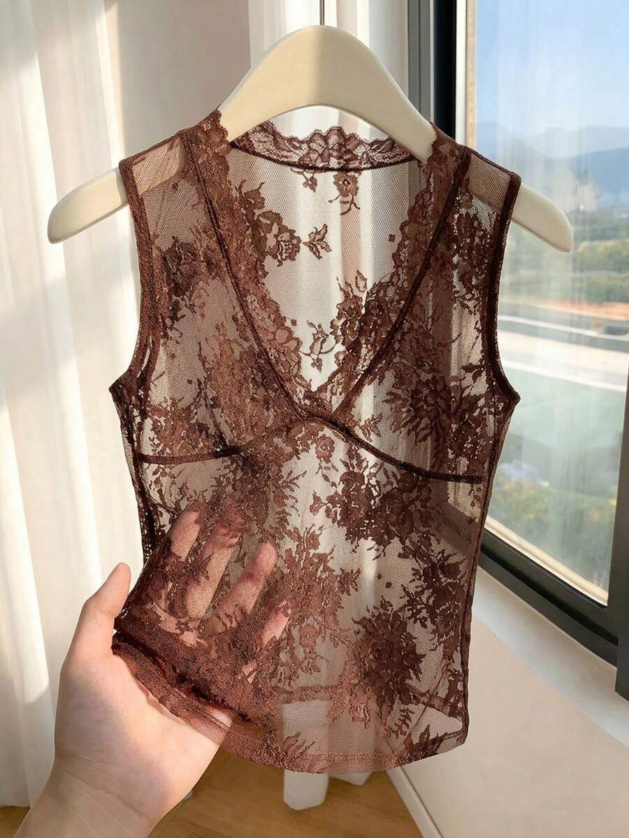 Franclia women's black semi-sheer lace camisole featuring a deep V-neckline with contrast lace trim in a slim fit sleeveless design.