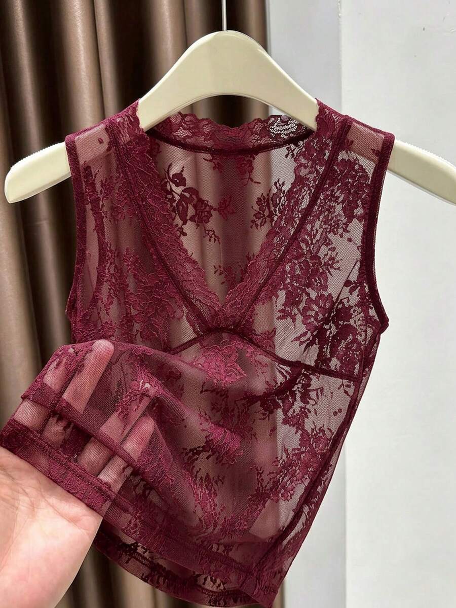 Franclia women's black semi-sheer lace camisole featuring a deep V-neckline with contrast lace trim in a slim fit sleeveless design.