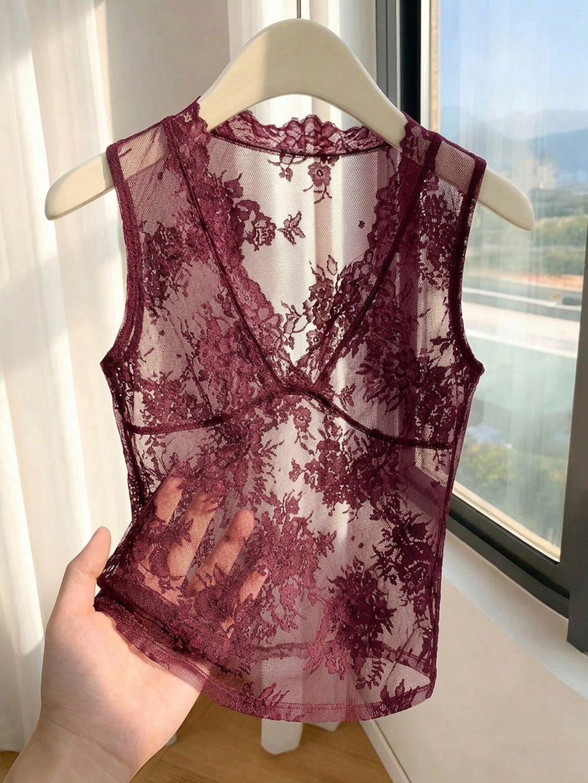 Franclia women's black semi-sheer lace camisole featuring a deep V-neckline with contrast lace trim in a slim fit sleeveless design.