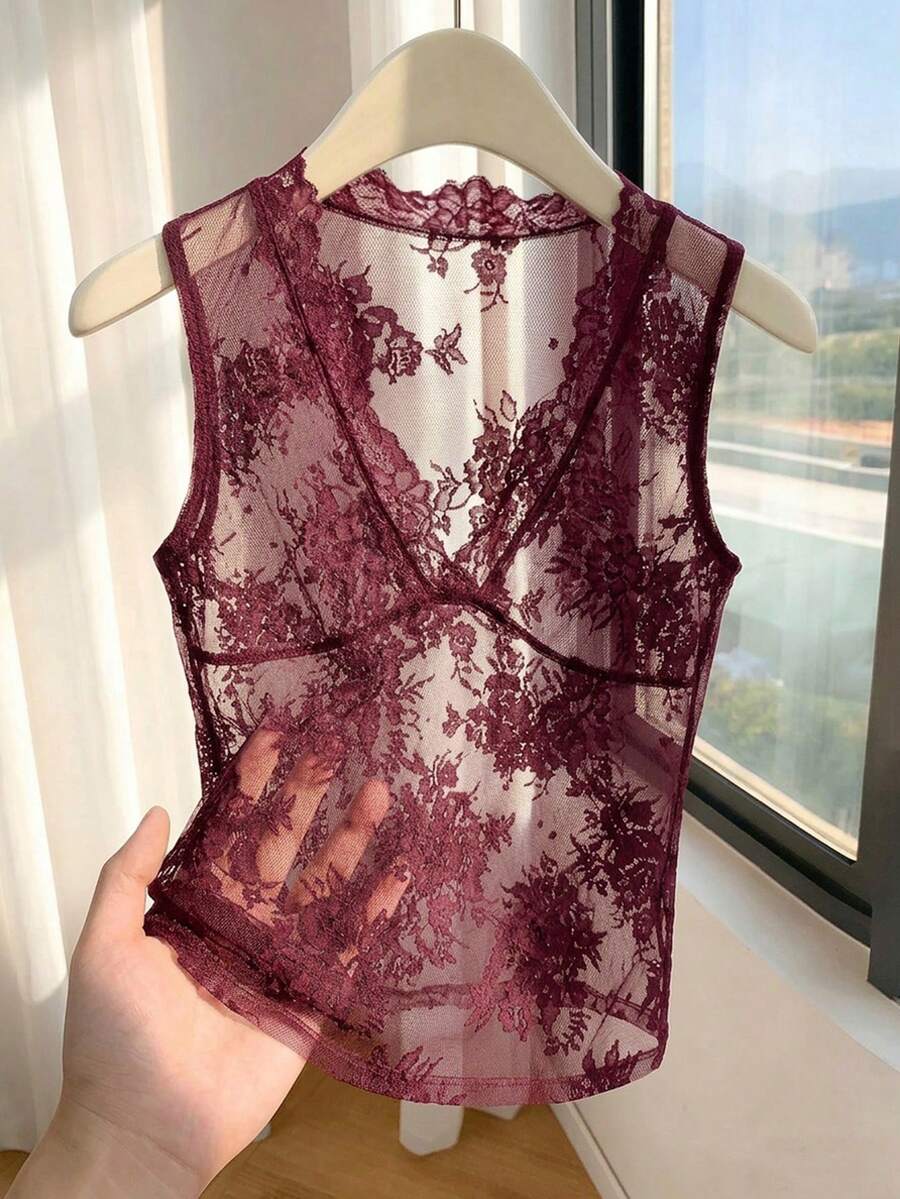 Franclia women's black semi-sheer lace camisole featuring a deep V-neckline with contrast lace trim in a slim fit sleeveless design.