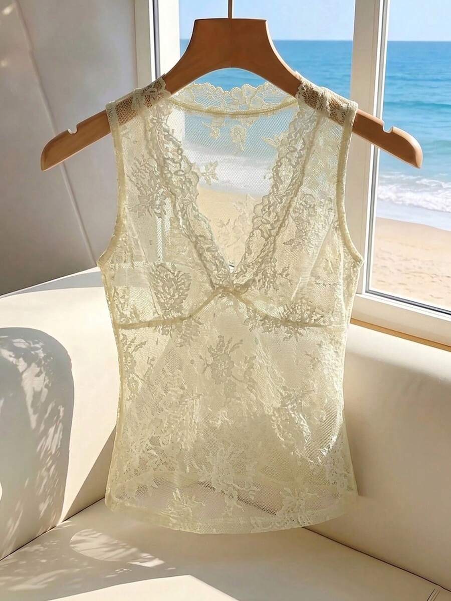 Franclia women's black semi-sheer lace camisole featuring a deep V-neckline with contrast lace trim in a slim fit sleeveless design.