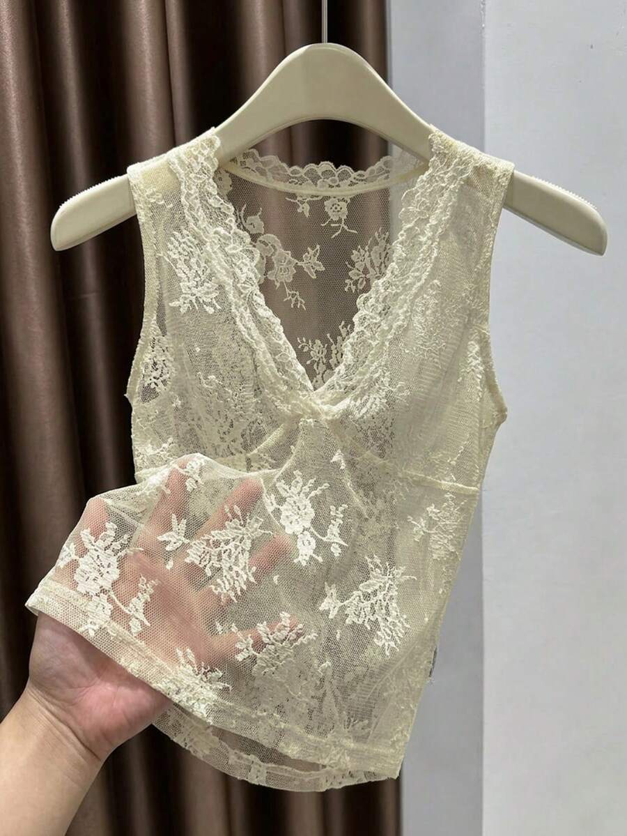 Franclia women's black semi-sheer lace camisole featuring a deep V-neckline with contrast lace trim in a slim fit sleeveless design.